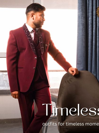 Timeless outfits for timeless moments. The maroon suit is shown in a sophisticated setting, highlighting its rich color and elegant fit.