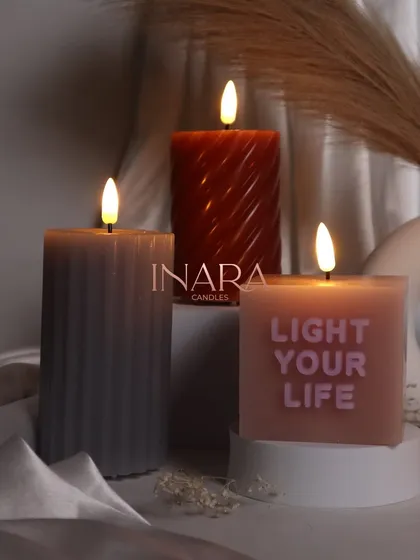 The warm glow of our new pillar candle collection. These designs are perfect for creating a cozy and inviting atmosphere in any room.