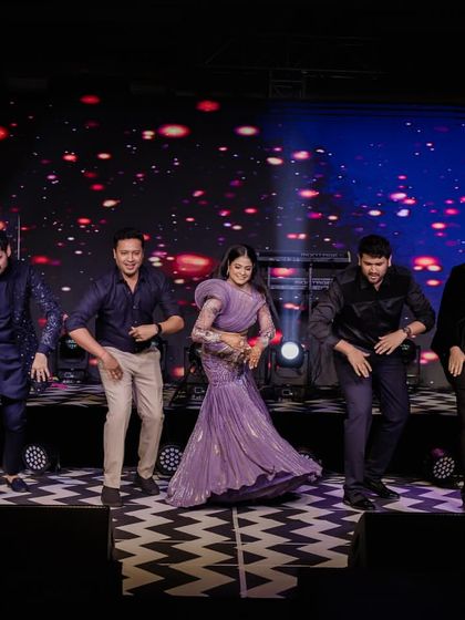 The bride leading her friends in a high-energy dance. The joy and energy are absolutely contagious.