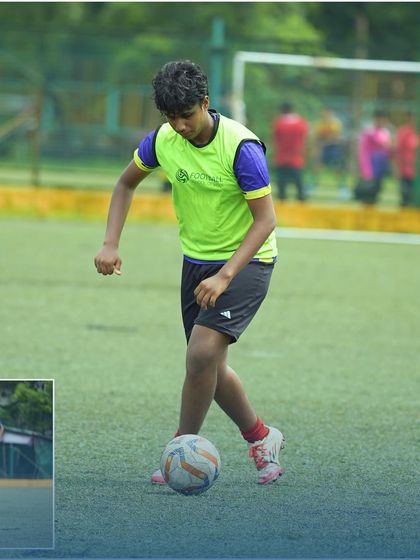 A player in a neon bib works on his ball control, a snapshot of the focused environment at our training sessions.