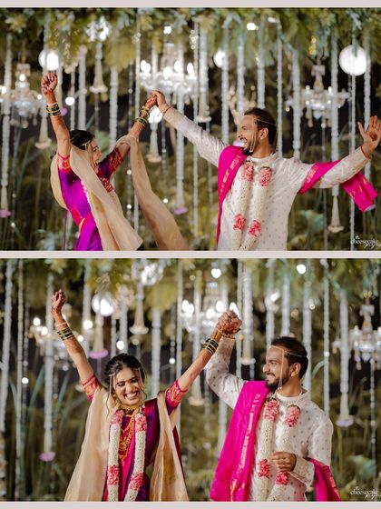Pure celebration! The couple raises their hands in joy during their Maharashtrian wedding.