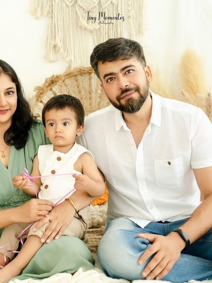 A lovely family portrait in our natural-toned, boho-inspired setting. The warmth of the decor complements the warmth of their family bond.