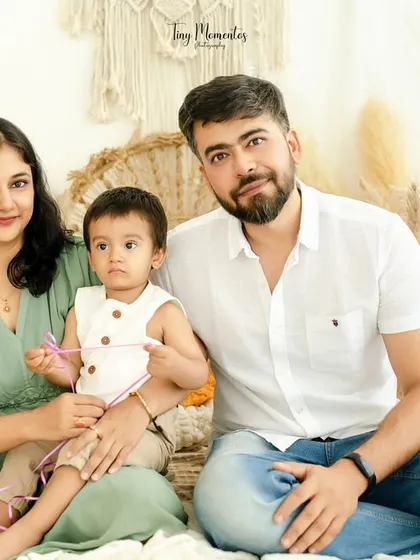 A lovely family portrait in our natural-toned, boho-inspired setting. The warmth of the decor complements the warmth of their family bond.