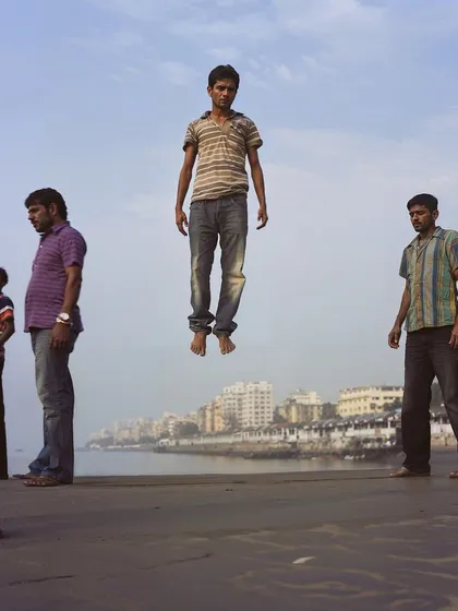 A young man levitates at Marine Drive in Mumbai, as others look on nonchalantly. This series plays with the idea of the extraordinary becoming ordinary in a city like Mumbai.