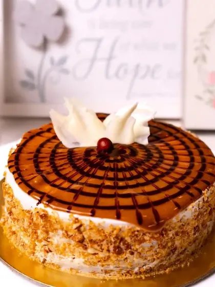 This is our classic Butterscotch Cake, with crunchy butterscotch pieces embedded in a light sponge and caramel drizzle. It's a nostalgic and comforting flavor.
