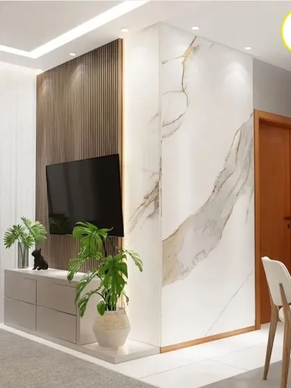 A corner view highlighting the marble-clad pillar next to the TV unit. This design choice adds a touch of luxury and defines the living space.