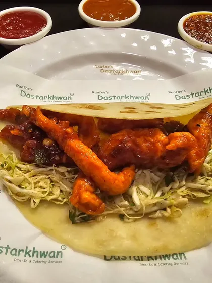 A spicy and tangy Chicken Chili Roll, filled with Indo-Chinese style chili chicken. This roll offers a perfect fusion of flavors for those who like it hot.