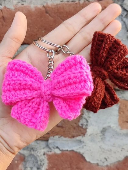 Coquette bow keychains available in a whole spectrum of colors, from bold reds and pinks to earthy tones.