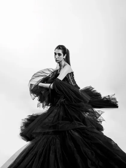 I use monochrome to strip away distractions and focus on form and emotion. This shot is all about the drama of the silhouette, using a voluminous black gown to create a piece of wearable art.
