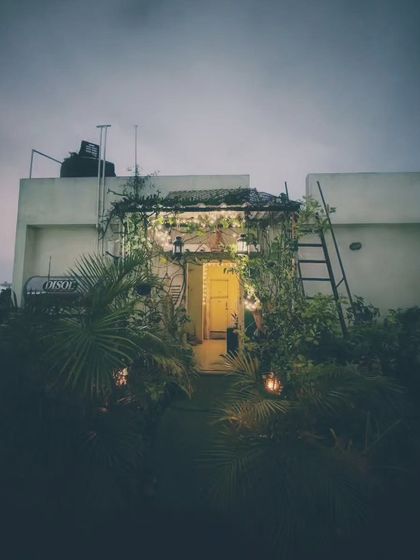 A wider perspective of the rooftop sanctuary at night. It shows how even a small structure on a terrace can be transformed into a magical, glowing retreat.