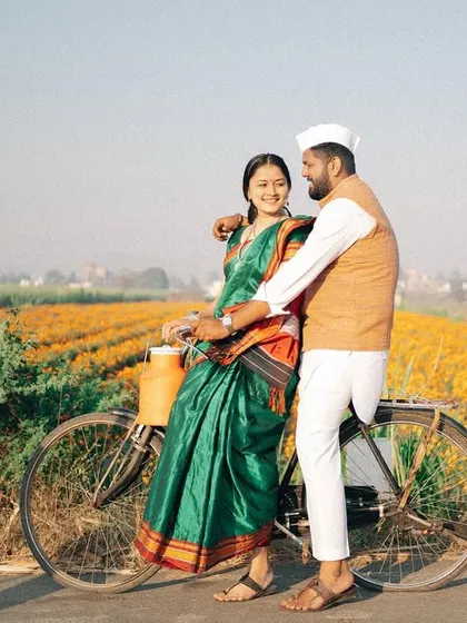 Capturing the joy of the journey together. This shot, with the couple on a classic bicycle against the backdrop of a marigold farm, has a timeless, rustic feel that is perfect for telling a traditional love story.