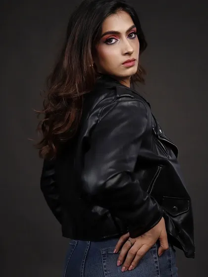 Another angle from the leather jacket series, with the model looking over her shoulder, adding a dynamic and confident feel to the portrait.