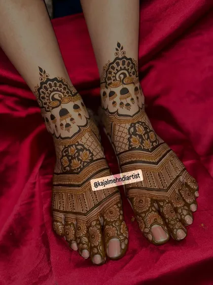 An angled view of the peacock and bells leg design.