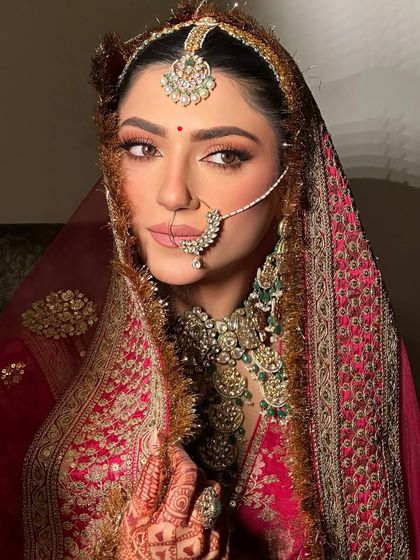 A close-up of the beautiful details. The makeup enhances her features while letting the magnificent jewelry shine.