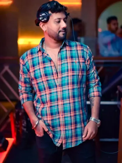 A candid shot in a plaid shirt. My journey is about starting from nothing and stopping for nothing.