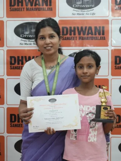 A teacher congratulates her student on her achievement.