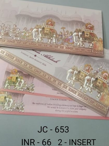 This card features a classic baraat scene with decorated elephants and musicians, embossed for a textured feel. It's a beautiful representation of traditional wedding festivities, available with matching inserts.