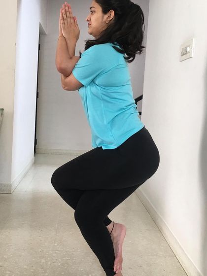 Another angle of Garudasana, showing the stability required in the standing leg.