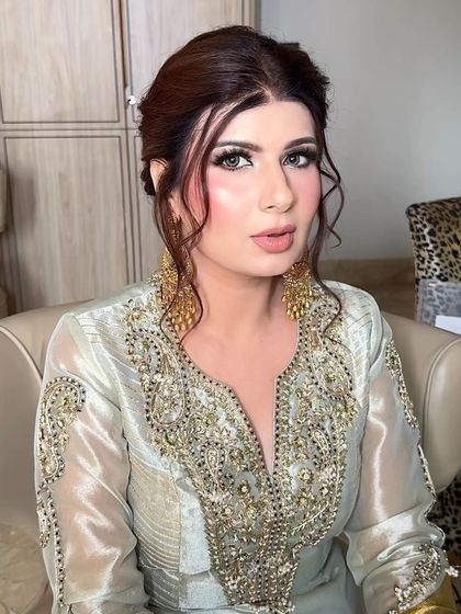 A close-up of the face. Her skin looks like glass, and her eyes are sparkling. It's a look that is both glamorous and ethereal.