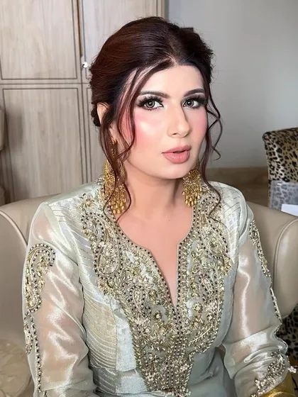 A close-up of the face. Her skin looks like glass, and her eyes are sparkling. It's a look that is both glamorous and ethereal.