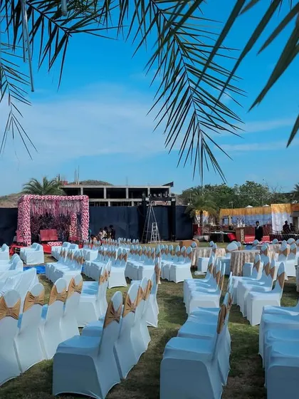 We can transform any large outdoor space into the perfect venue for your destination wedding events. This lawn is set up with organized seating and multiple stages, ready for a day of celebration under the open sky.