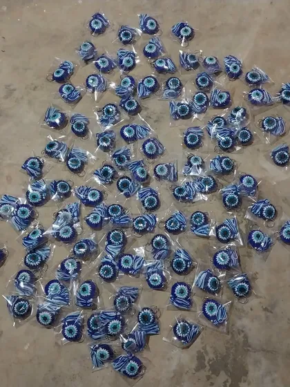 A massive order of 100 evil eye keychains, all packed and ready to be shipped to Mumbai.