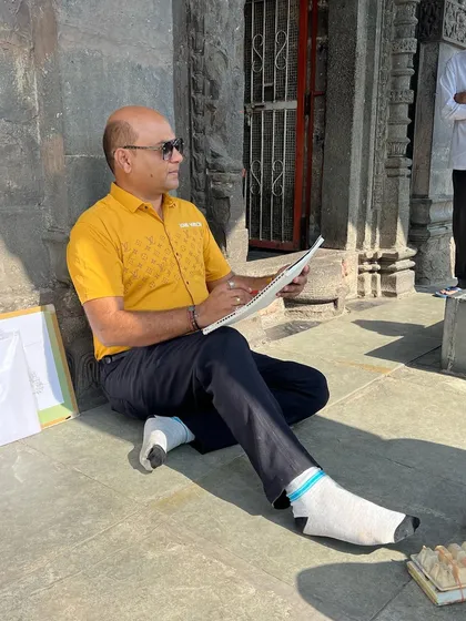 Seated on the steps of the Goda Ghat in Nashik, I am sketching in tribute to the late art master V.G. Kulkarni on his death anniversary. This is how artists pay homage, by creating art in places that hold meaning.