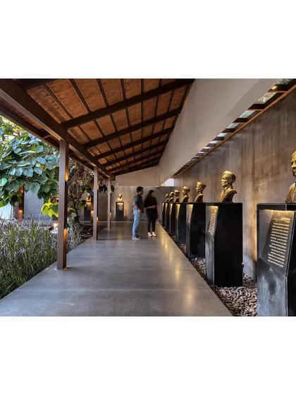 The Rishi Pavilion at the KLE Centenary Museum, which serves as the primary entry passage. This space demonstrates our approach to performative landscape design, where new structures guide the visitor's journey and frame the display of historical artifacts.