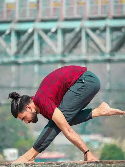 Parsvottanasana, or Pyramid Pose, is an intense side stretch. This variation adds a twist and a bind, challenging balance and deepening the stretch in the hamstrings and spine.
