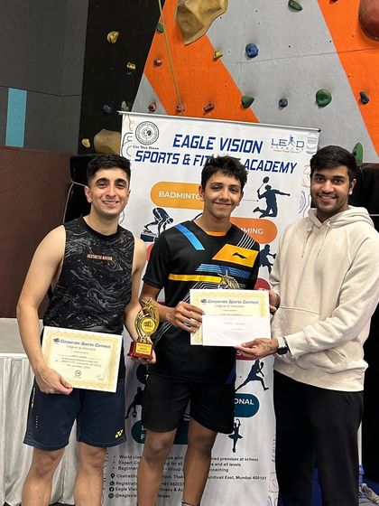 Our coaches celebrating a men's doubles win at the Corporate Sports Connect Tournament. Their success serves as a direct inspiration for our students.