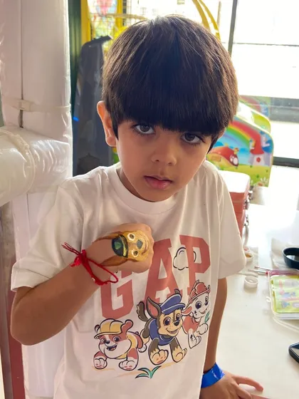 A Paw Patrol fan proudly shows off his new hand-painted tattoo.