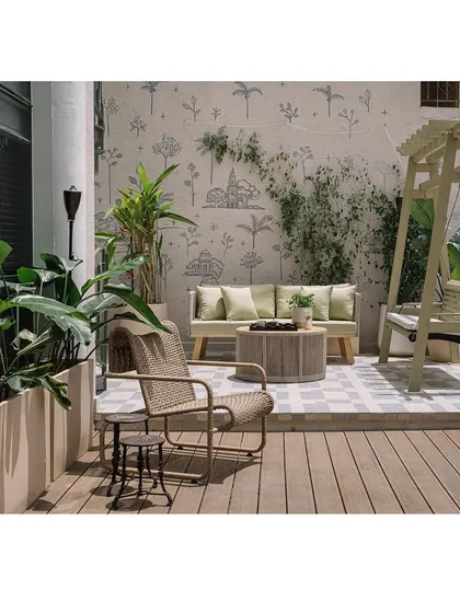 The outdoor deck off the formal living room is a charming retreat. A hand-painted mural and a bougainvillea-lined arch create a picturesque seating nook.
