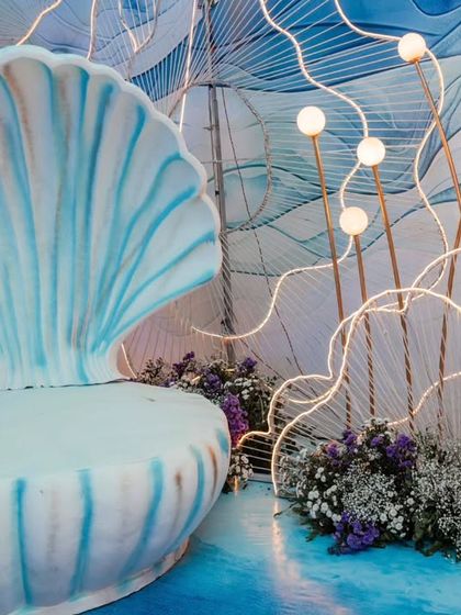 A magnificent, oversized seashell chair serves as a throne for the birthday girl and a stunning photo spot. Large, statement props like this are a hallmark of my event designs.