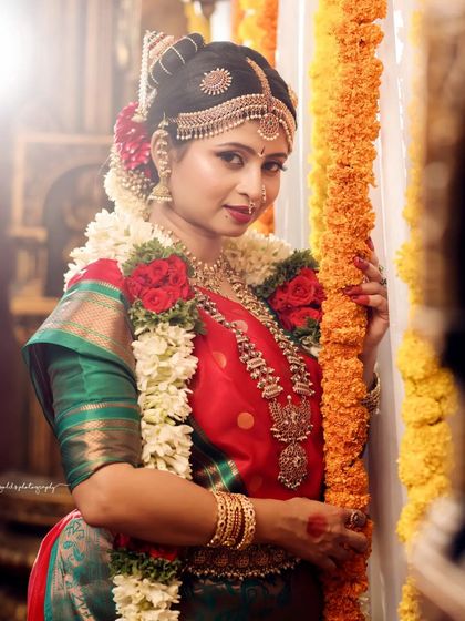 A beautiful Iyengar bride look, complete with traditional temple jewelry and flower garlands. These shots are perfect for a bridal portfolio, showcasing the complete look from makeup to attire.