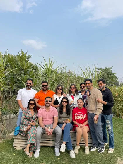 A group of friends enjoying a sunny day at the farm. It's a great escape from the city for a relaxed weekend get-together.