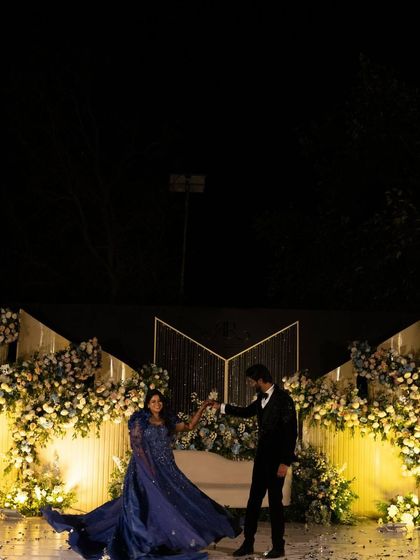 A fairytale moment for Raksha and Ram during their reception. We designed a modern, elegant stage with cascading florals and soft lighting, perfect for the couple's first dance.