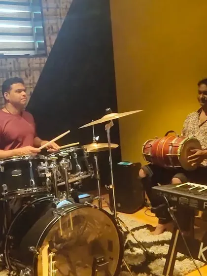 The rhythm section of my band, 27 STAARS, locked in a groove during rehearsals. The drummer, dholak player, and keyboardist are the foundation of our sound.