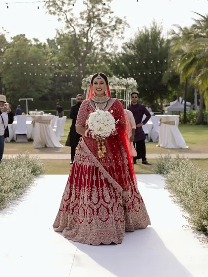 Dressed in a stunning red lehenga, she walked down the aisle at her Hua Hin beach wedding, a vision of grace and hope. Her journey from Australia to this moment was a story in itself, and I was there to capture its beautiful beginning.