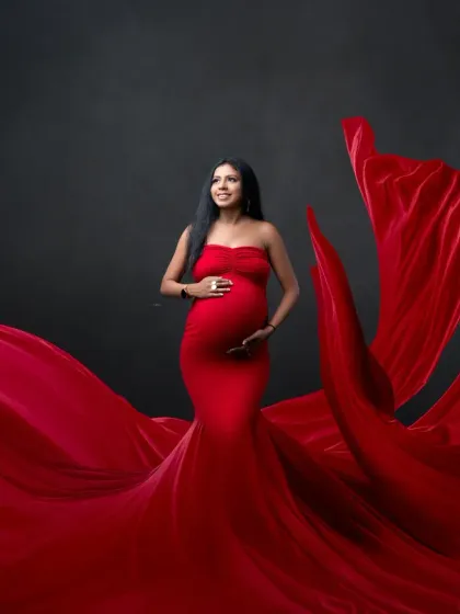 Simple, bold, and beautiful. This portrait focuses on the mother-to-be in a stunning red gown, with the flowing fabric creating a work of art.