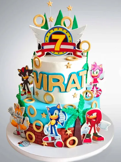A two-tier Sonic the Hedgehog cake for a 7th birthday. This design is packed with characters and action, perfect for a big fan of the speedy blue hero.