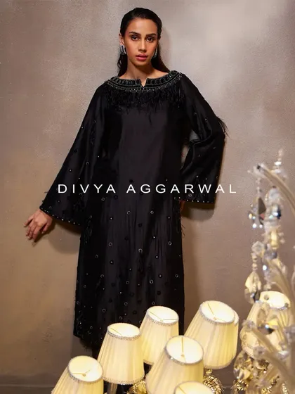 A stunning black kurti set, where fine fabrics and signature designs come together for a truly unforgettable and elegant look.