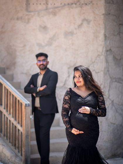 A candid-style shot capturing a quiet moment between the couple, with the unique textures of Old Dubai in the background.