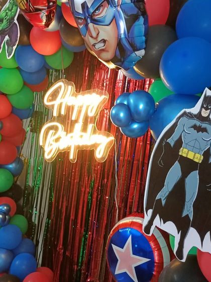 Another close-up of the superhero decor, showing Batman and Captain America foil balloons.