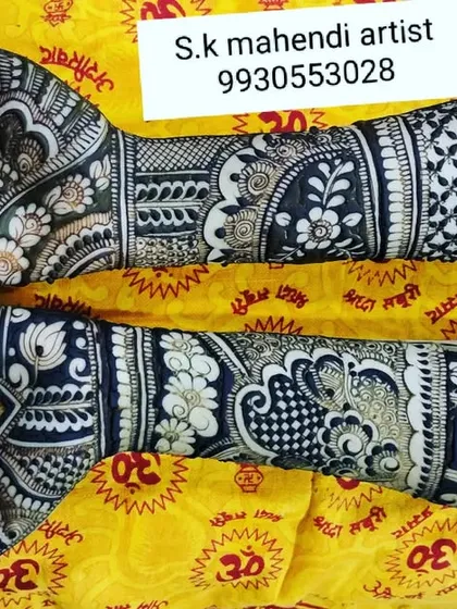 A very dense and intricate design with a mix of floral and geometric patterns. The use of negative space makes the motifs pop.