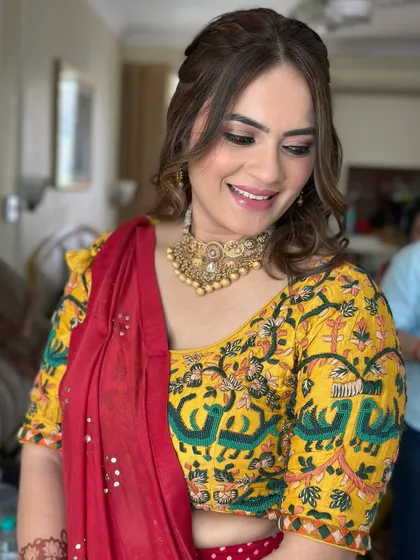 A happy smile from this gorgeous client. The makeup is kept soft and glowing to enhance her natural beauty, with a focus on clean skin and subtly defined eyes.