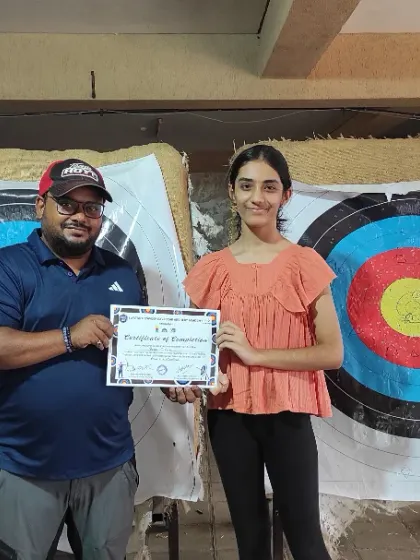 This young woman proudly accepts her certificate. Completing the course is a great achievement and a stepping stone for further practice.