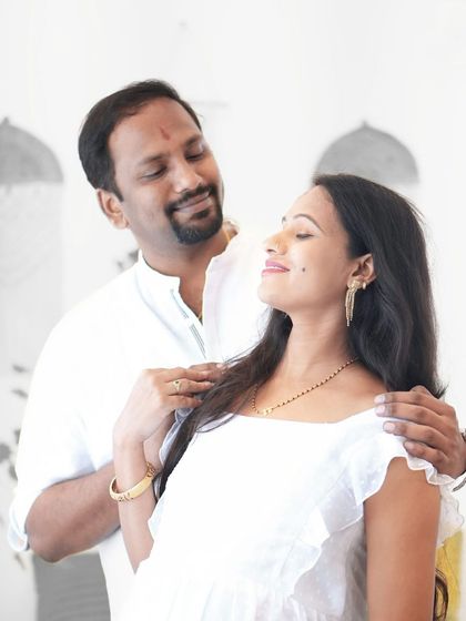 An intimate portrait of an expecting couple. The soft, natural light and their gentle embrace make this a timeless and romantic maternity photograph.