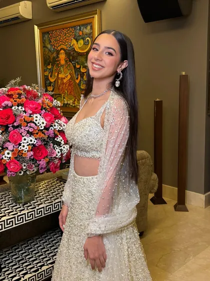 The sister of the bride serving main character energy. This soft pink glam look with a sharp winged liner is perfect for a cocktail party.