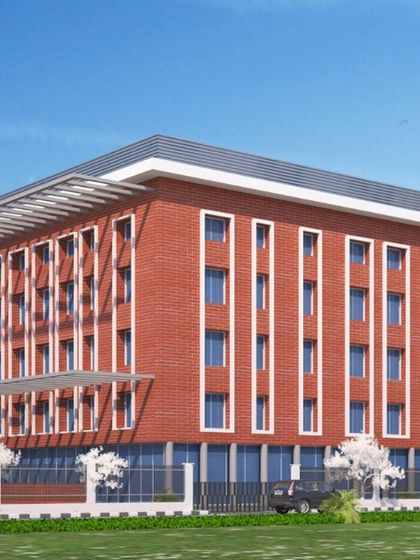 This architectural render shows a clean, institutional design with a rhythmic facade of red brick and vertical windows. The design is both modern and orderly, suitable for an educational setting.