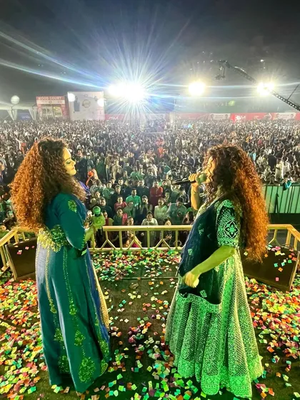 This view from the stage is our greatest blessing. Looking out at a sea of happy faces during a Navratri Mahotsav, with confetti in the air, reminds us why we do what we do. We thrive on connecting with thousands of people at once.
